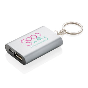 Poslovni pokloni | Promo pokloni | 1.000 mAh promotivna rezervna baterija / powerbank s reklamnim privjeskom za ključeve s tiskom logotipa, sive boje